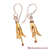 <img src="yellow-harakeke-silver-earrings.jpg" alt="A pair of yellow harakeke inspired silver earrings on a white background showing copper stamen">