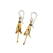 <img src="yellow-harakeke-silver-earrings.jpg" alt="A pair of yellow harakeke inspired silver earrings on a white background">