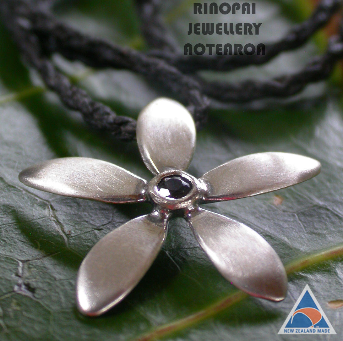Jewellery NZ | Jasmine Silver Flower Necklace black chord on leaf | Redmanuka