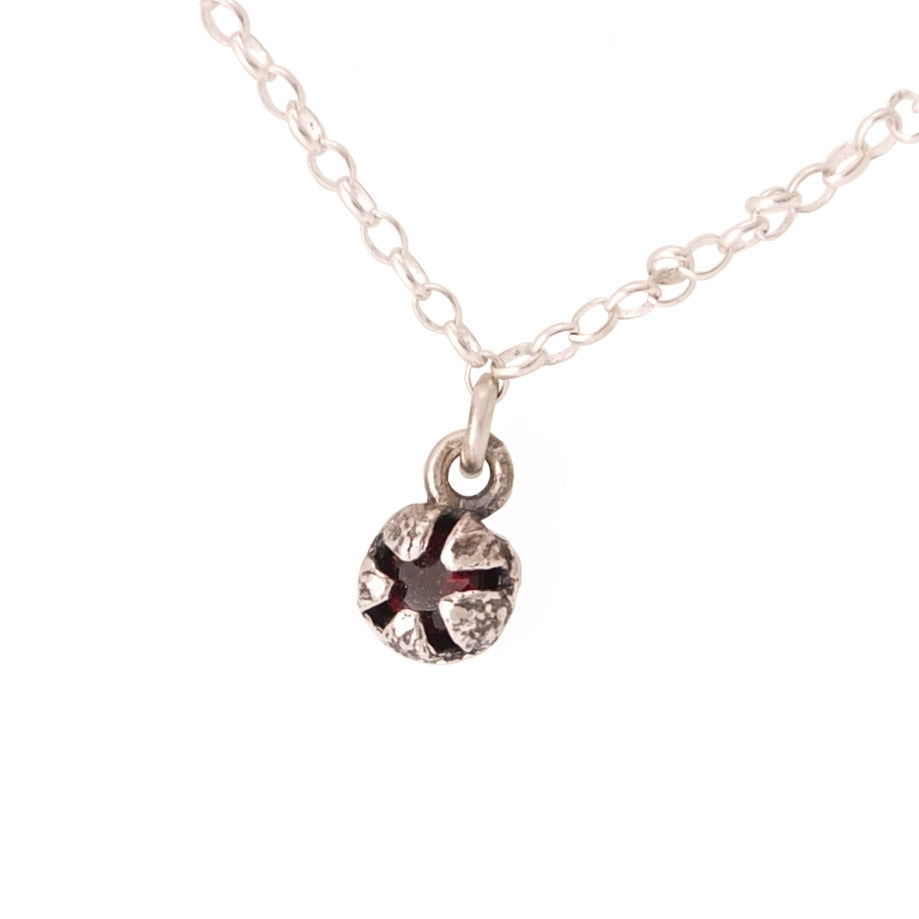 Small Silver Mānuka Seed Pod with A Garnet set inside the pod