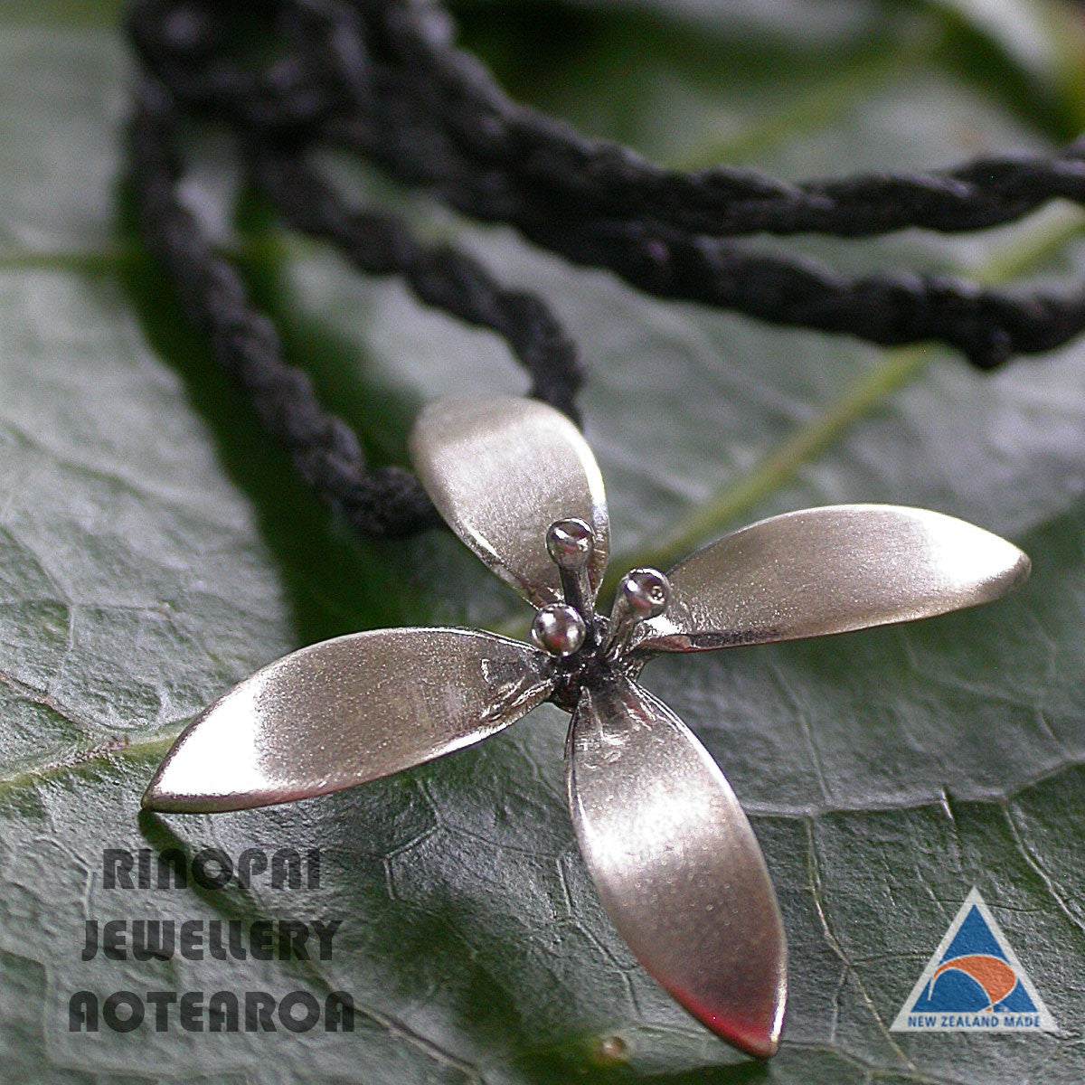 Silver Summer Flower necklace on hand plaited chord by nz jeweller Martyn Milligan, Rinopai, Parapara, Golden Bay, Nelson